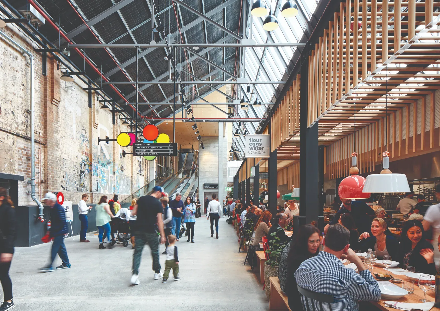 The restored Tramsheds interior at Harold Park operating as a public dining destination.